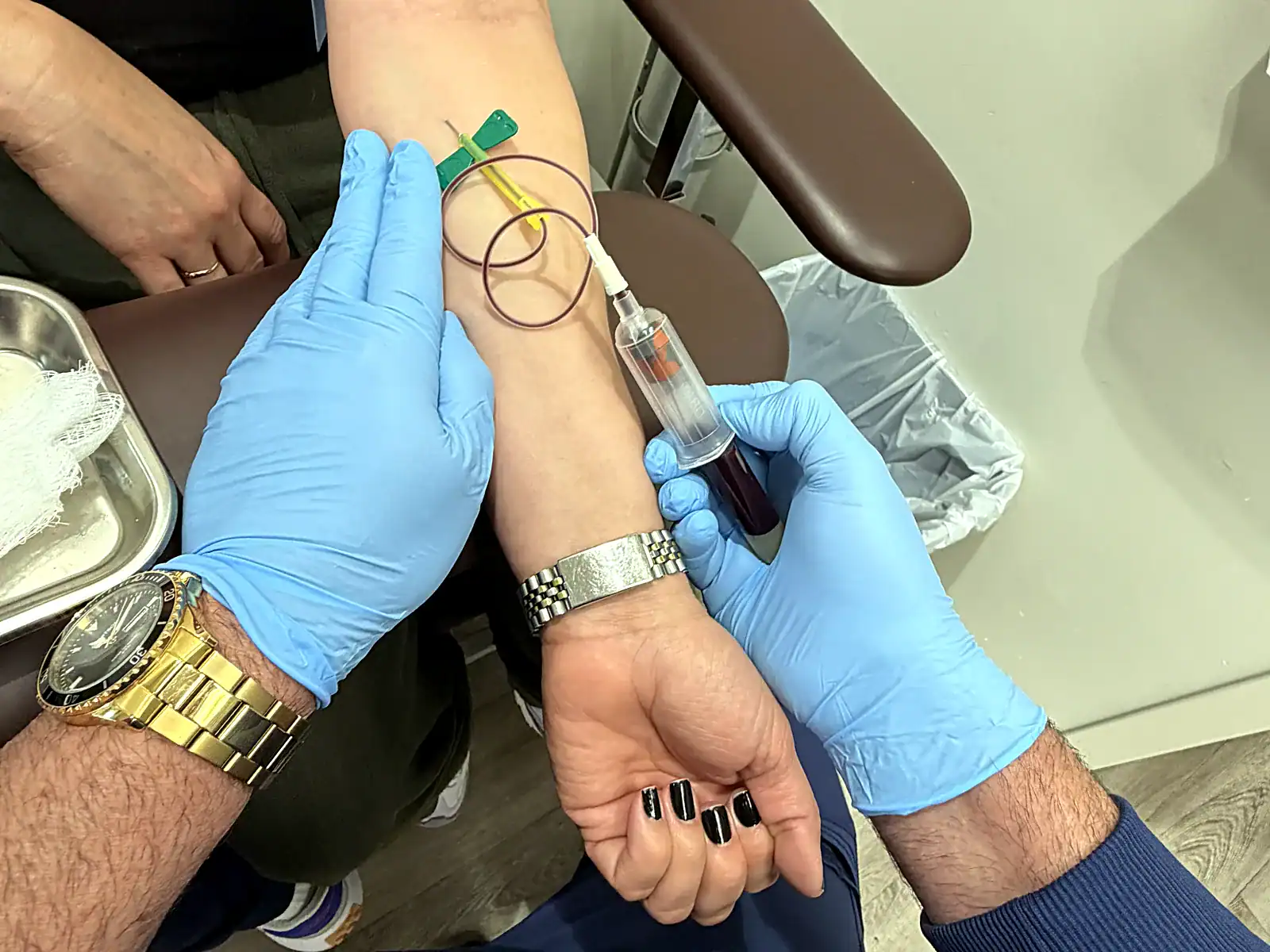 Blood draw performed at the PassQual Health on-site medical laboratory