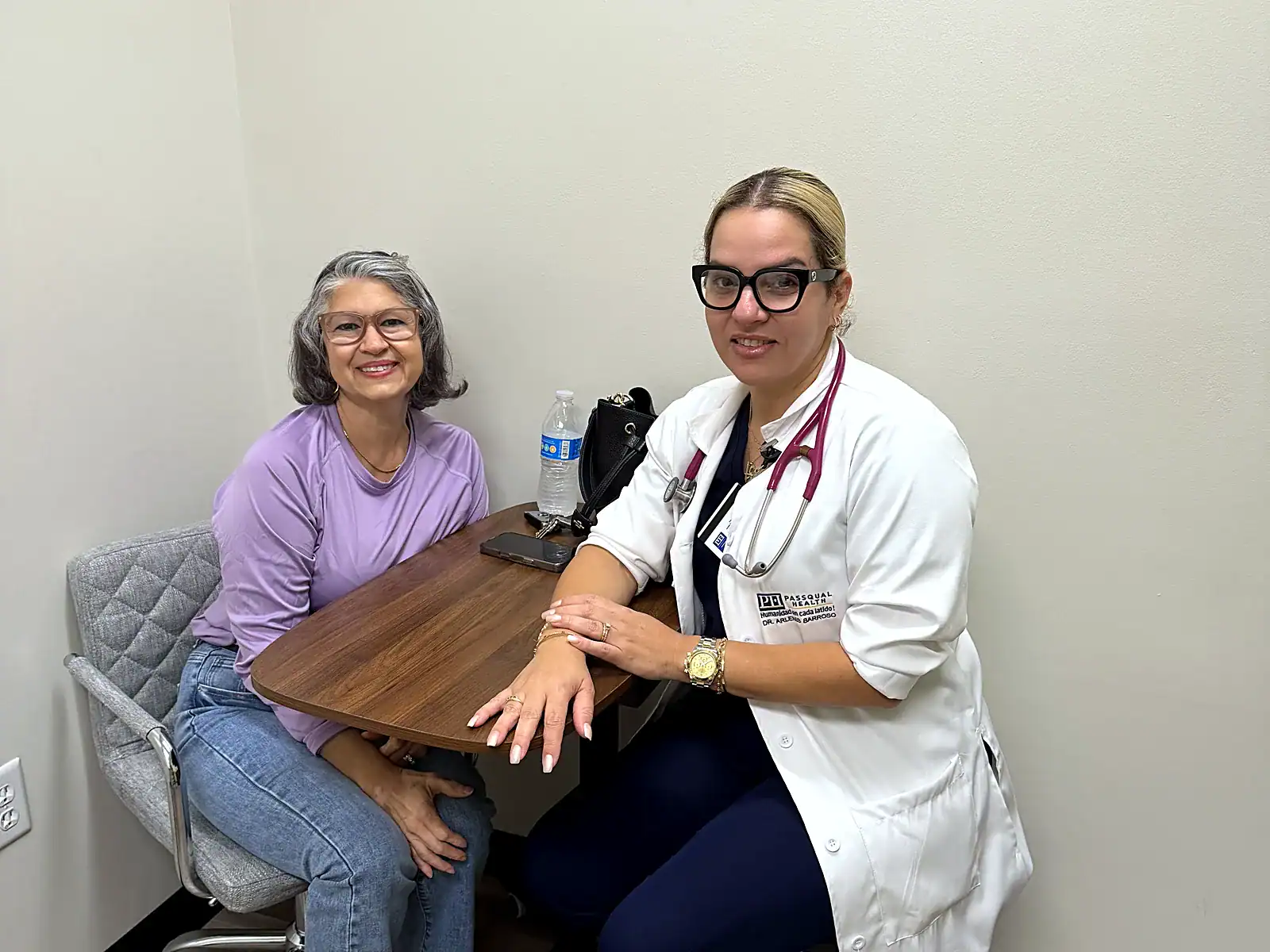 Primary care consultation between provider and patient at PassQual Health