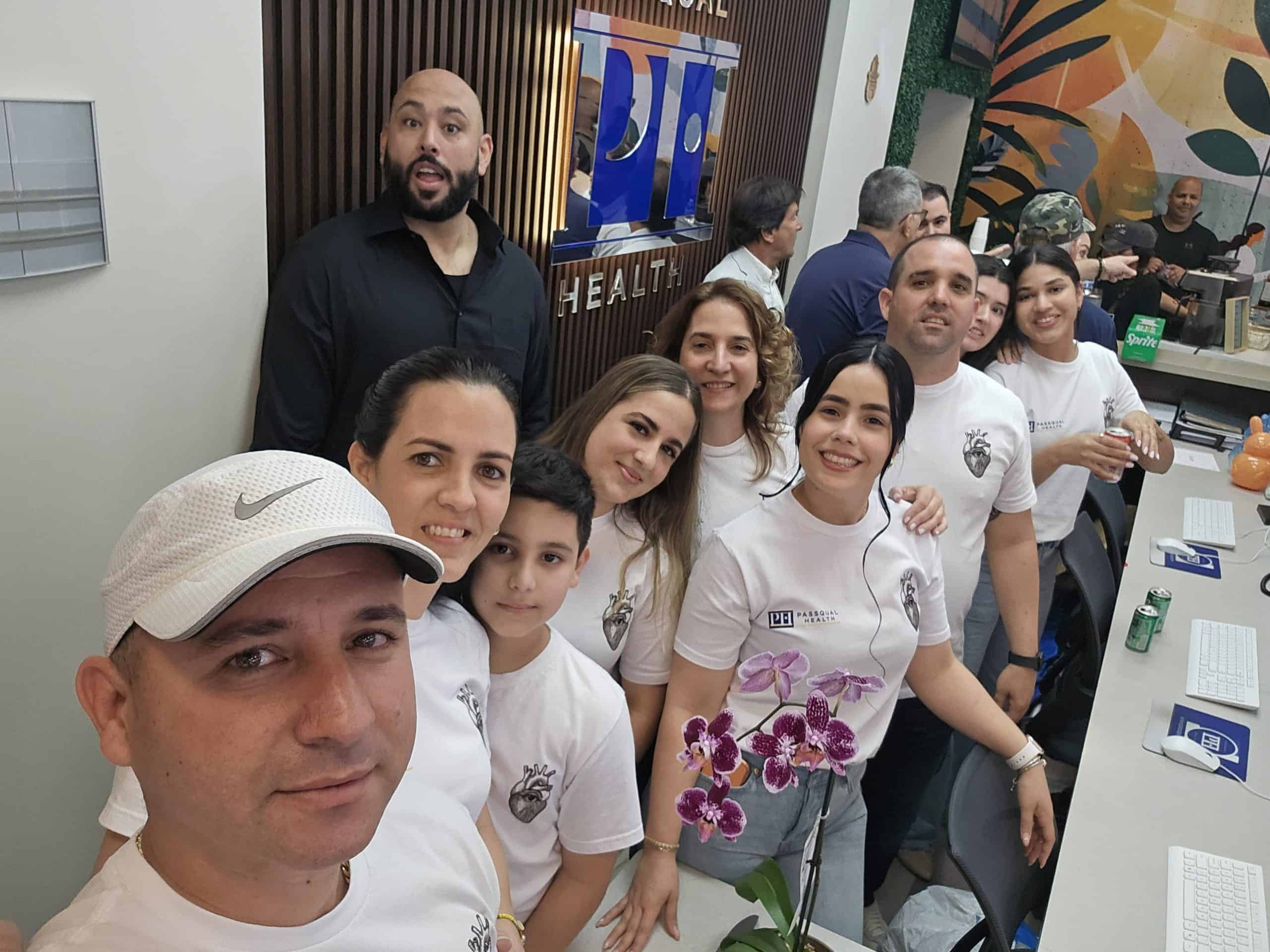 PassQual Health medical team with staff and patients in clinic.