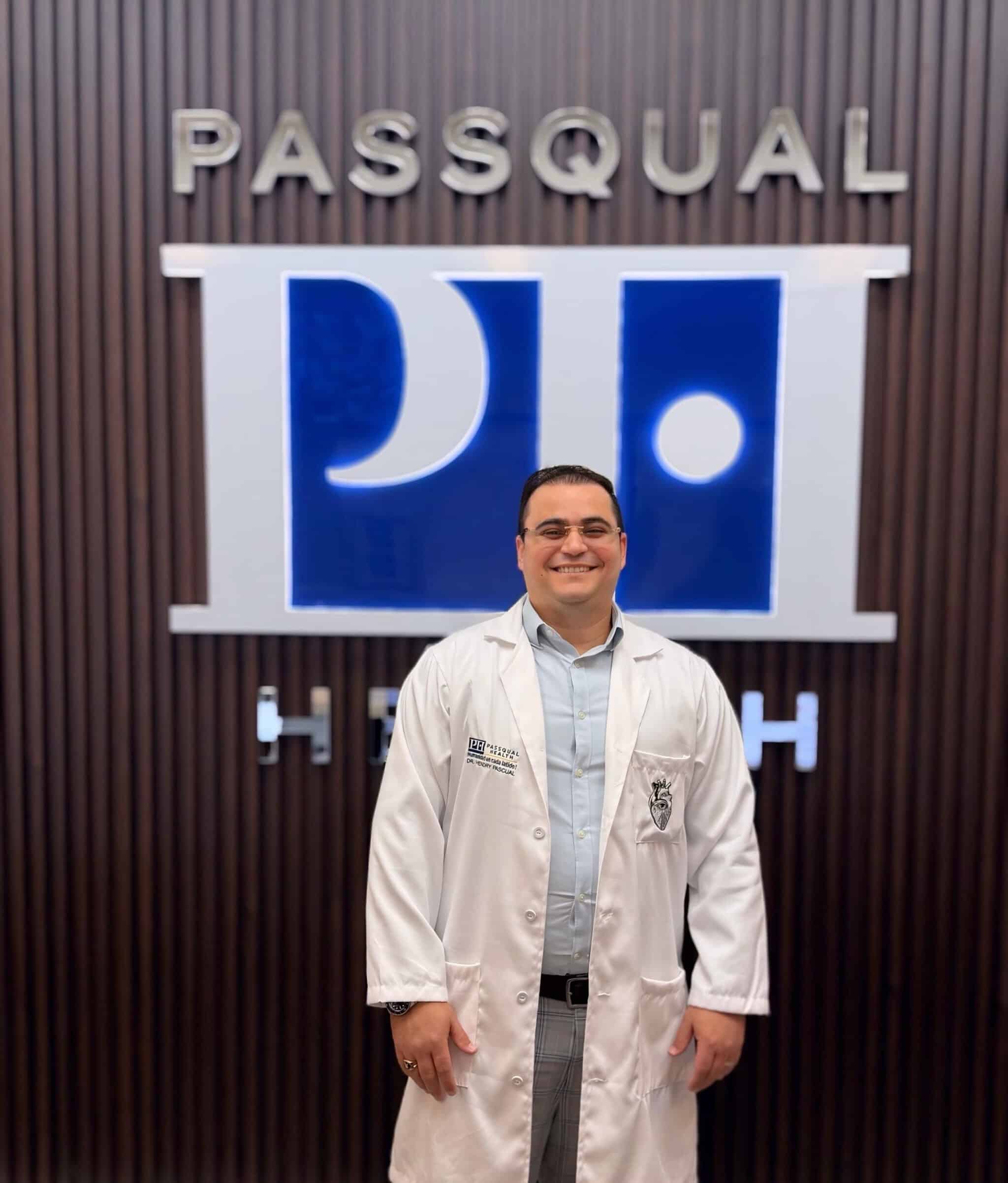 Portrait of Dr. Hendry Pascual, MD, CEO and co-founder of PassQual Health, wearing a white coat
