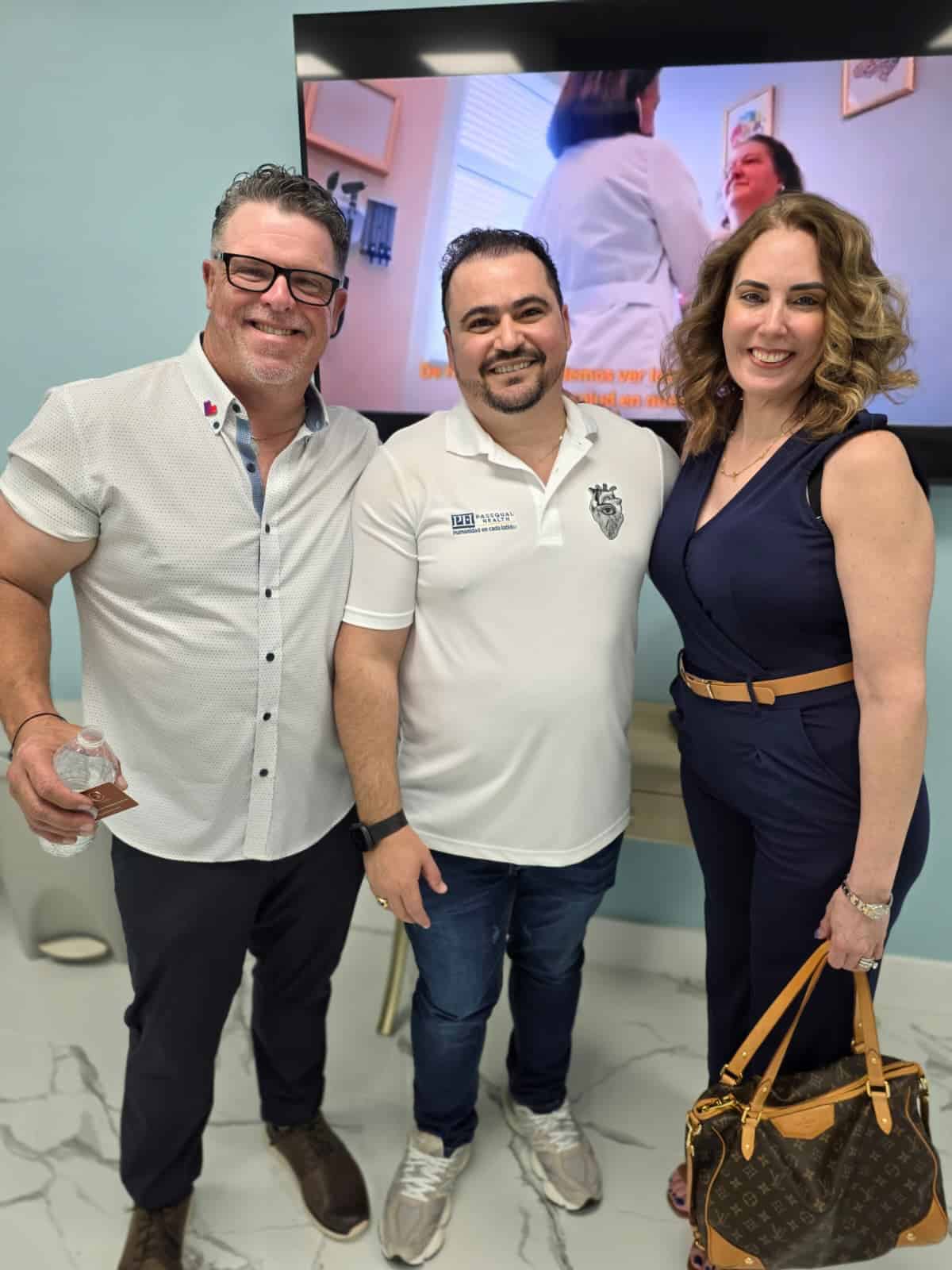 Group of healthcare professionals smiling at PassQual Health.