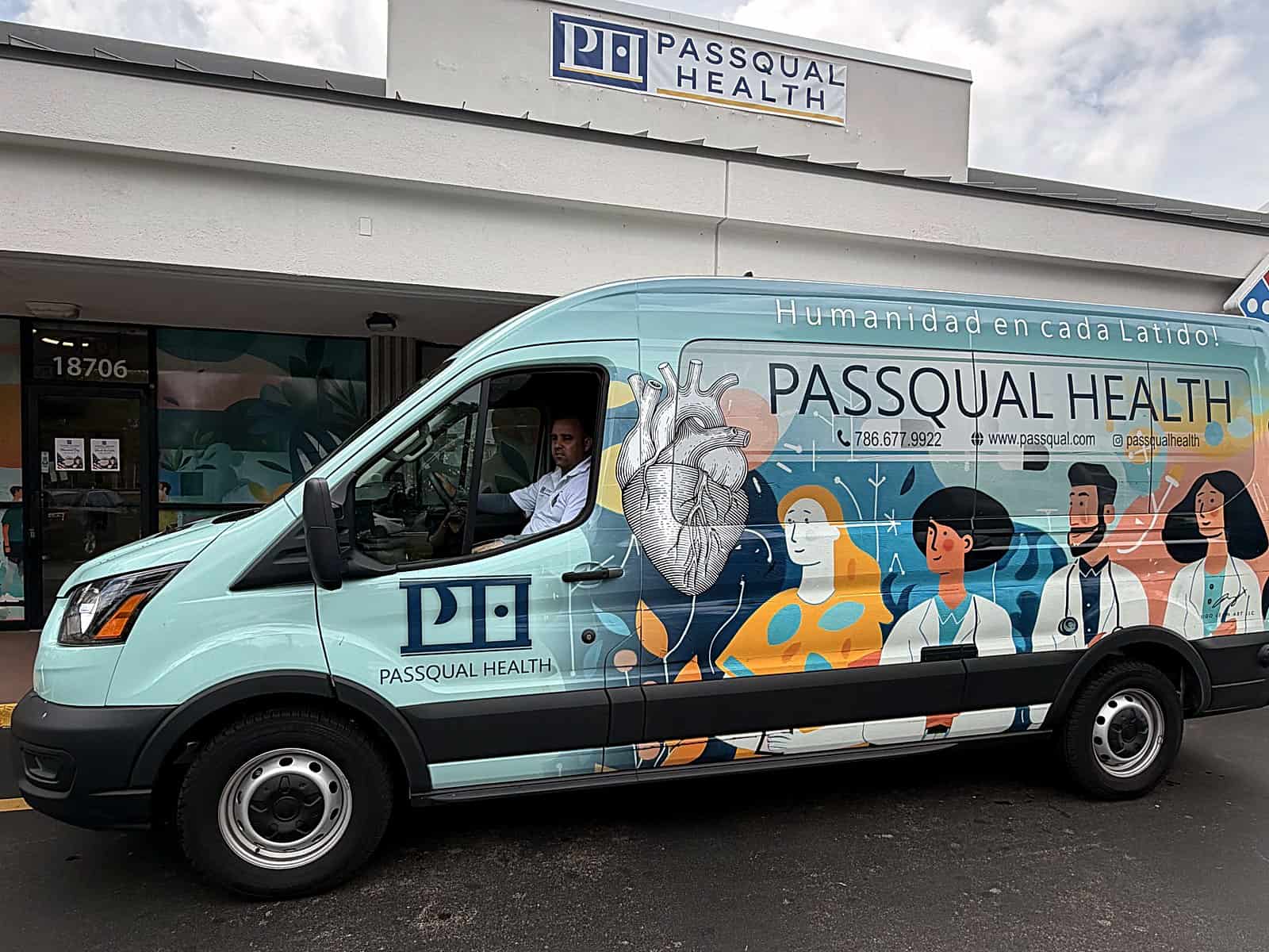 The PassQual Health branded van parked outside the Miami Gardens clinic, beneath the practice storefront sign